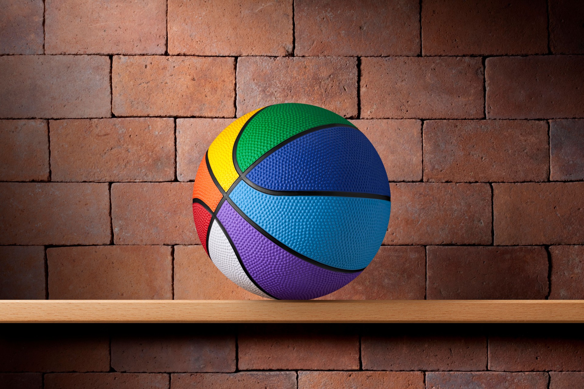 Multi-coloured basketball ball on the shelf